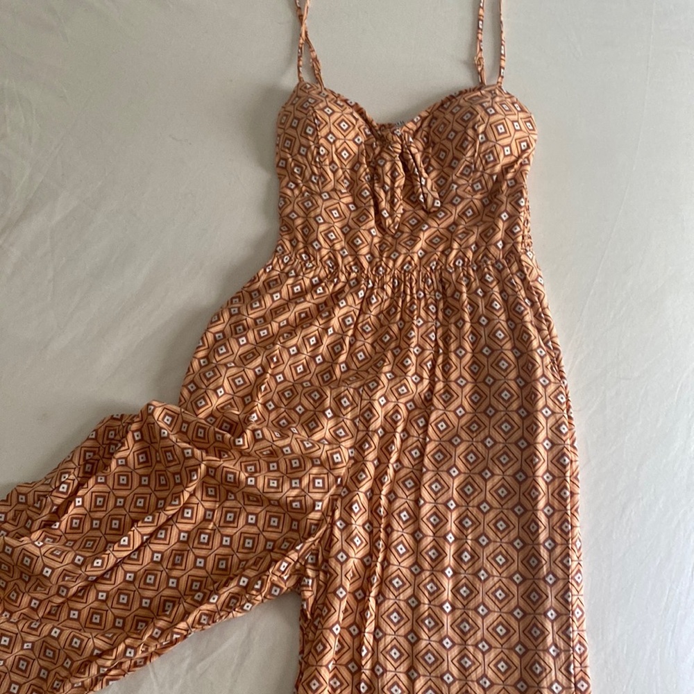 One piece jumper with 70s print and gaucho style pants